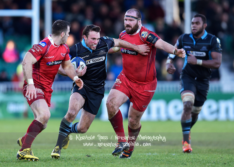 Mike Blair breaks through the Llanelli Scarlets' defence during the European Rugby Champions Cup match at Scotstoun Stadium.